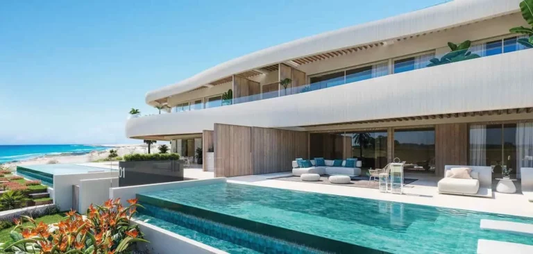 Luxurious beachfront villa with an infinity pool overlooking the azure sea, exemplifying the exclusive lifestyle and investment potential on Costa del Sol.